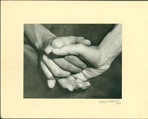 [Black and white photograph of clasped hands]