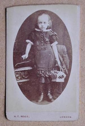 Carte De Visite Photograph: Portrait of a Young Girl Holding a Basket.