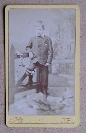 Carte De Visite Photograph: Portrait of a Young Boy Standing Beside a Gate.