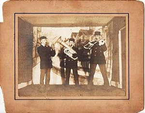 GROUP PHOTOGRAPH OF THE THREE MEMBERS OF THIS UNUSUAL BRASS BAND, COMPRISING CORNET, TUBA, AND SL...