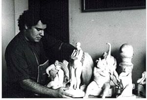 Photograph of the Artist with sculptures holding la Mujer del Circo.