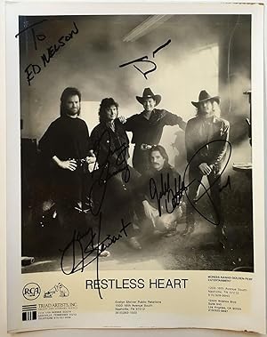 Promotional photographed signed by all five band members