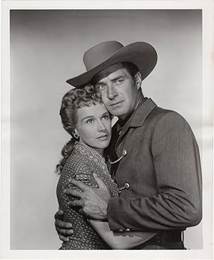 Money, Women and Guns (Two original publicity photographs of Jock Mahoney and Kim Hunter from the...