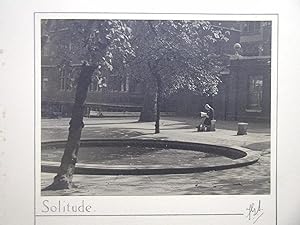 Solitude. (View of a Woman Seated Beside a Circular Pond).