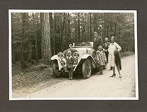 Germany, German Tourists posing with their car