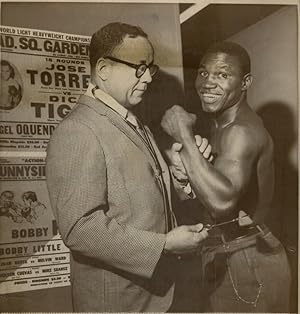 New York, Dick Tiger receives a tap from Dr. Edwin Campbell