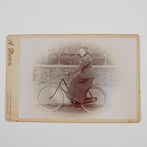 Cabinet card depicting a female cyclist.