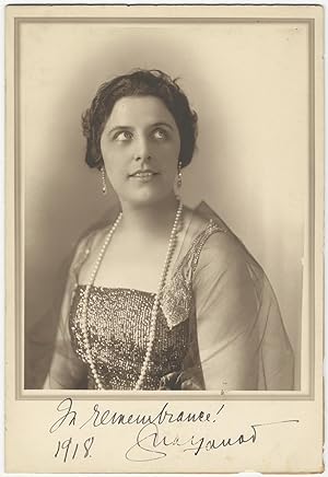 Fine large bust-length photograph of the famed soprano in formal dress boldly signed "In remembra...