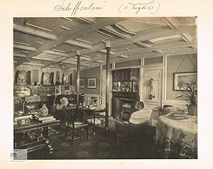 Interior View of the saloon and library with many books, maps and nautical instruments on board o...