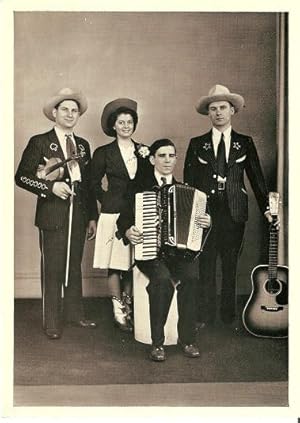 LARGE REAL-PHOTO POSTCARD, SHOWING DOC WILLIAMS, HIS WIFE CHICKIE, BROTHER CY, AND MARION MARTIN:...