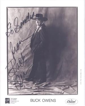 PROFESSIONAL, SIGNED PHOTOGRAPH OF BUCK OWENS:; in elaborate western suit, hat and boots