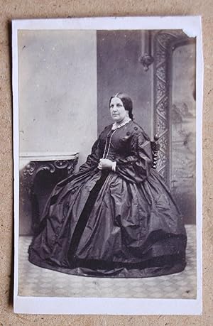 Carte De Visite Photograph. A Studio Portrait of a Seated Woman in a Fine Dress.