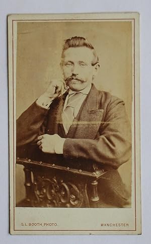 Carte De Visite Photograph. Studio Portrait of a Suited Gentleman with a Moustache.