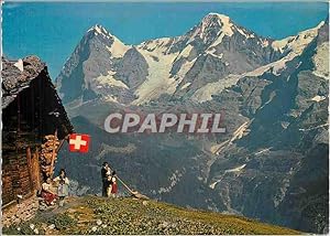 Carte Postale Moderne Joueur du Cor des Alpes et sa Famille L'Eiger et Le Monch
