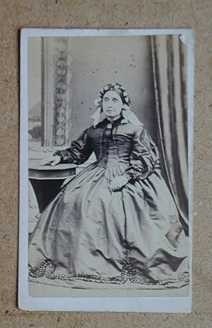 Carte De Visite: Studio Portrait of a Finely Dressed Lady.