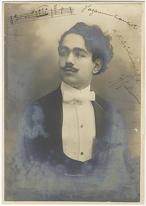 Fine half-length photograph of this Armenian-born violinist and composer in formal dress. Signed ...