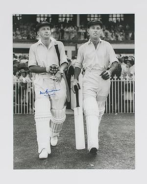 An original signed photograph of Don Bradman walking out to bat with Jack Fingleton