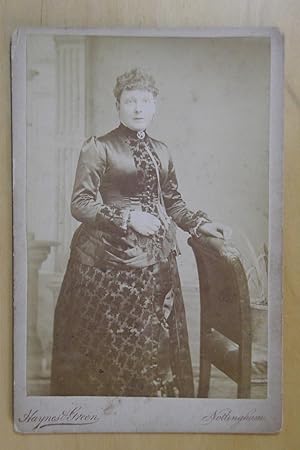 Cabinet Photograph. Studio Portrait of a Finely Dressed Lady.