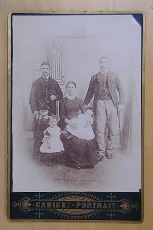Cabinet Photograph: A Studio Portrait of a Family with Young Child.