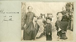 Indochine, Annam, Une musicienne annamite et sa famille, ca.1910, Vintage silver print
