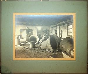 [Photography, Industrial] Silver print of a Bell foundry showing eight very large bells