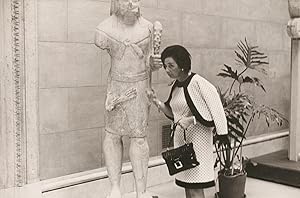 A Photograph, Not Titled (A woman knocks on an ancient statue to check if it is stone or wood) 22...