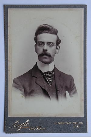 Cabinet Photograph: A Portrait of a Young Man with a Moustache & Spectacles.