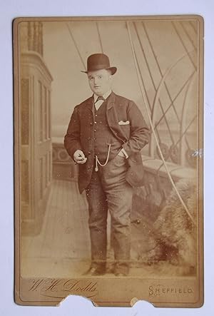 Cabinet Photograph: A Portrait of a Young Man with A Ship Theme Backdrop.