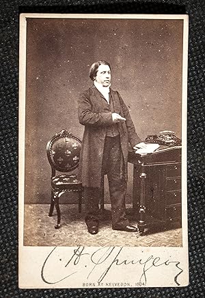 Original photograph or Carte de Viste of C.H. Spurgeon standing at his desk