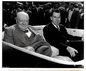 An original press photograph of Prime Minister Sir Winston Churchill on 25 June 1954 being greete...