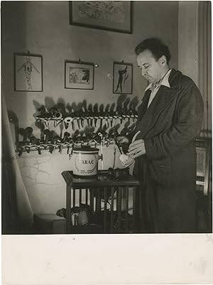 Original photograph of Arthur Honegger filling his pipe, circa 1940s