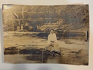 [DREAMY SILVER PRINT PHOTOGRAPH ca. 1910]. Woman seated on a river bank