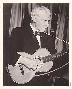 Original photograph of Carl Sandburg playing the guitar, circa 1955