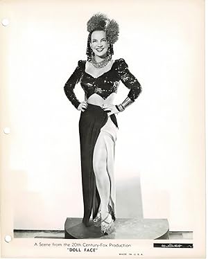 A VINTAGE PUBLICITY GLAMOUR PHOTOGRAPH of CARMEN MIRANDA in a scene from 20th Century-Fox's "DOLL...