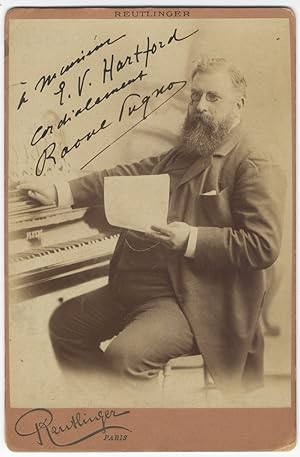 Fine cabinet card photograph by Reutlinger of Paris of the noted pianist seated at the keyboard. ...