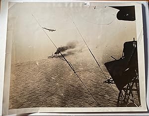 "First Photo of Surrender of German Armada." "British airship flying over a German battleship dur...