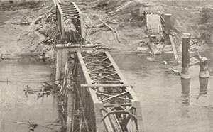 After attack by R.A.F. Thunderbolts, March 1945. A bridge over the Myitnge river, carrying the ma...