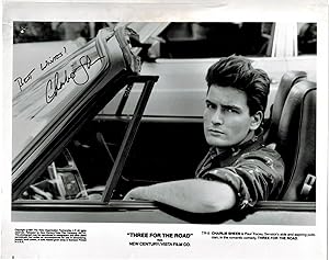 SIGNED AND INSCRIBED Publicity Photograph of Charlie Sheen in "Three for the Road"