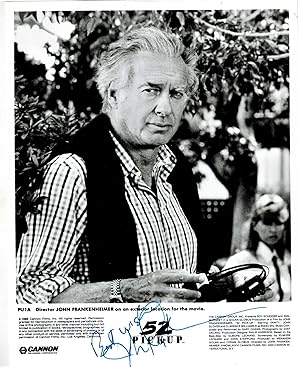 SIGNED AND INSCRIBED Publicity Photograph of Director John Frankenheimer on an exterior location ...