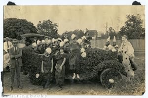 [Photograph]: Kenedy, Texas Art Car with Women and Clowns circa 1920s; Photograph by Dedrick in K...