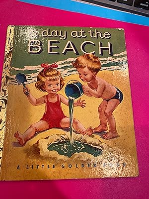 A DAY AT THE BEACH a Little Golden Book