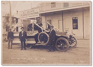 1915 Photograph of Eustis, Florida showing a local business car festooned for President's Day