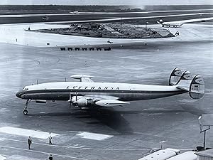 1970s Glossy Black and White Photo of a Lufthansa Super Constellation (L-1049G) Jet In Flight