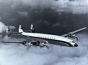 1970s Glossy Black and White Photo of a Lufthansa Lockheed Starliner L-1649 A In Flight