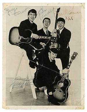 Signed photograph by the Beatles.