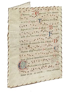 Legatura in pergamena manoscritta da pagina di corale con note musicali e capilettera colorati. S...