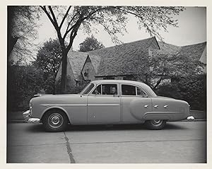 Collection of 13 original photographs of a Packard 200, documenting the car's performance during ...