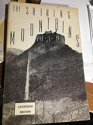 The Shining Mountains. Signed
