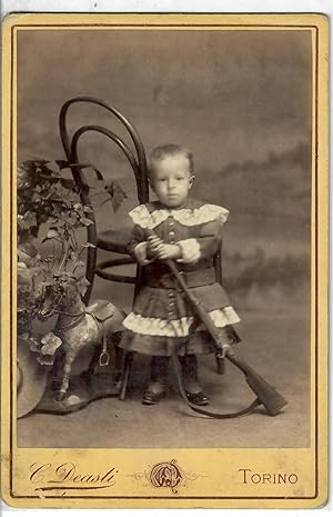 [Young Italian Boy with Gun and Toy Horse]