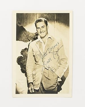 A portrait photograph inscribed and signed 'Hello Dolores | Errol Flynn'